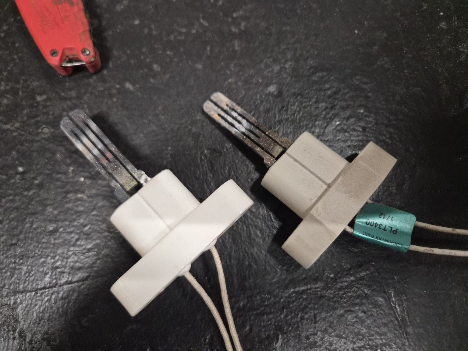 Two hot-surface igniters shown side by side, with visible differences in wear and surface condition.